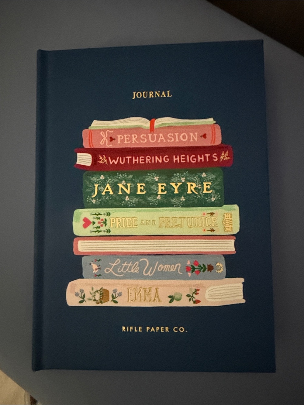 Rifle Paper Co. Navy Hardcover Journal with Colorful Stacked Book Illustration